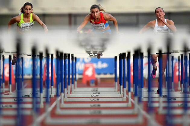 Russia's Ekaterina Galitskaya (C) competes in the women's 100m hurdles final at a track and field meet called 'Stars of 2016' in Moscow on July 28, 2016.Russia's athletics federation holds a competition event for the athletes who have been banned from the Rio Olympics over evidence of state-sponsored doping and mass corruption in the sport. / AFP / Kirill KUDRYAVTSEV        (Photo credit should read KIRILL KUDRYAVTSEV/AFP/Getty Images)