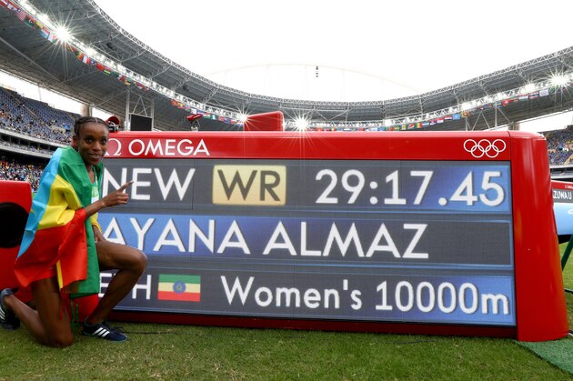 RIO DE JANEIRO, BRAZIL - AUGUST 12:  Almaz Ayana of Ethiopia celebrates winning the Women's 10000 Meters Final and setting a new world record of 29:17.45 on Day 7 of the Rio 2016 Olympic Games at the Olympic Stadium on August 12, 2016 in Rio de Janeiro, Brazil.  (Photo by Ian Walton/Getty Images)