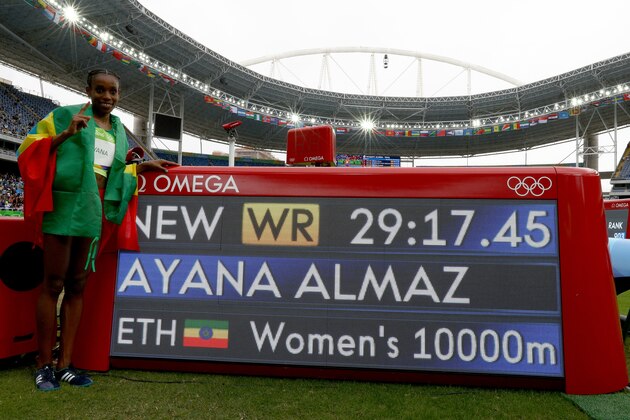 RIO DE JANEIRO, BRAZIL - AUGUST 12:  Almaz Ayana of Ethiopia celebrates winning the Women's 10,000 Meters Final and setting a new world record of 29:17.45 on Day 7 of the Rio 2016 Olympic Games at the Olympic Stadium on August 12, 2016 in Rio de Janeiro, Brazil.  (Photo by Ian Walton/Getty Images)
