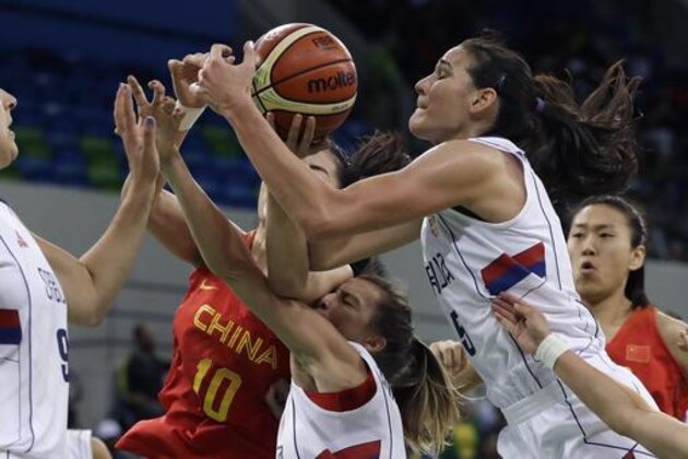 Serbia forward Sonja Petrovic, right, and China forward Wen Lu (10) battle for the rebound during the first half of a women's basketball game at the Youth Center at the 2016 Summer Olympics in Rio de Janeiro, Brazil, Friday, Aug. 12, 2016. (AP Photo/Carlos Osorio)