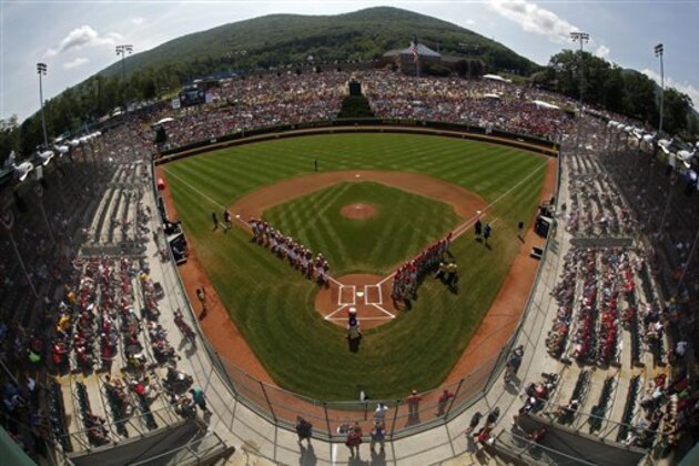 The Little League teams from Mexico, along the third baseline, and Japan are introduced before the International championship baseball game in Lamade Stadium at the Little League World Series tournament in South Williamsport, Pa., Saturday, Aug. 29, 2015. (AP Photo/Gene J. Puskar)