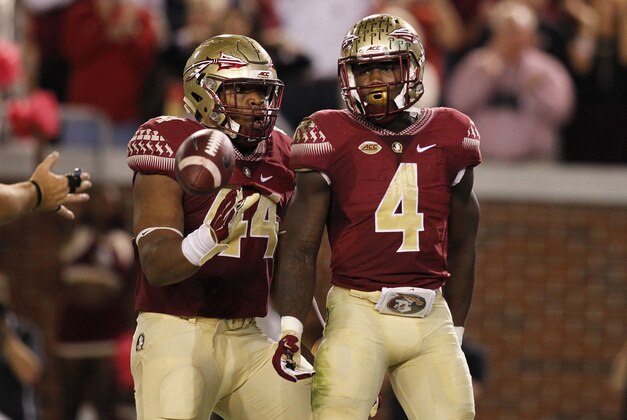 Oct 24, 2015; Atlanta, GA, USA; Florida State Seminoles running back Dalvin Cook (4) celebrates a touchdown run with running back DeMarcus Walker (44) against the Georgia Tech Yellow Jackets in the second quarter at Bobby Dodd Stadium. Mandatory Credit: Brett Davis-USA TODAY Sports