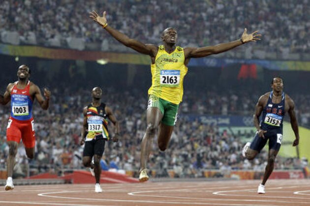 FILE - In this Aug. 20, 2008 file photo, Jamaica's Usain Bolt crosses the finish line to win the gold in the men's 200-meter final during the athletics competitions in the National Stadium at the Beijing 2008 Olympics in Beijing. How does Bolt's mother help the world's fastest man keep his cool?