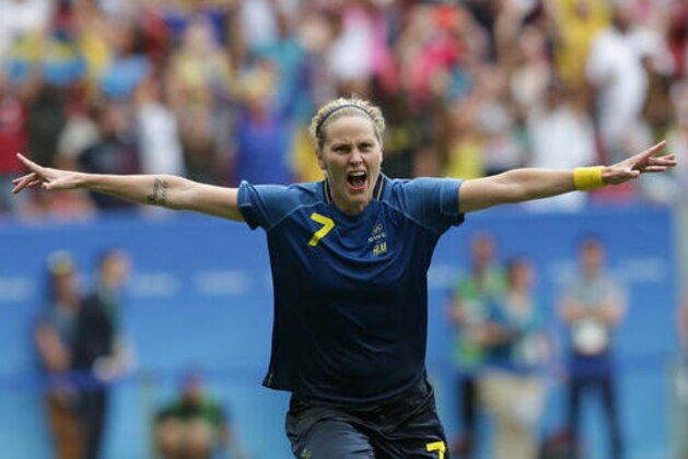 Sweden's Lisa Dahlkvist celebrates after scoring in the penalty kicks during a quarter-final match of the women's Olympic football tournament between the United States and Sweden in Brasilia Friday Aug. 12, 2016. Sweden beat the United Sates on penalty shootout.(AP Photo/Eraldo Peres)