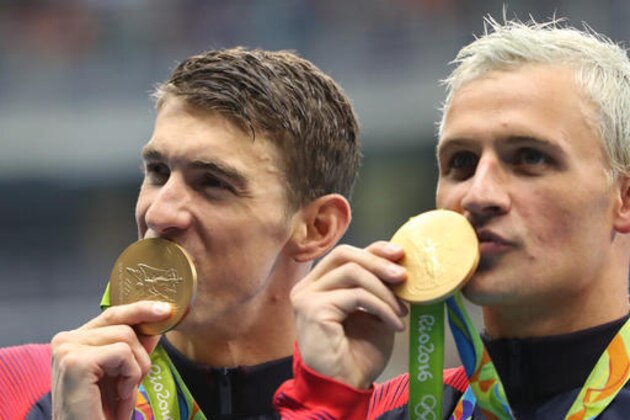 United States' Michael Phelps and Ryan Lochte, right, celebrate winning the gold medal in the men's 4x200-meter freestyle relay during the swimming competitions at the 2016 Summer Olympics, Wednesday, Aug. 10, 2016, in Rio de Janeiro, Brazil. (AP Photo/Lee Jin-man)