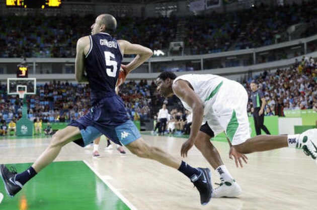 Argentina's Manu Ginobili (5) drives past Nigeria's Ike Diogu (6) during a men's basketball game at the 2016 Summer Olympics in Rio de Janeiro, Brazil, Sunday, Aug. 7, 2016. (AP Photo/Eric Gay)