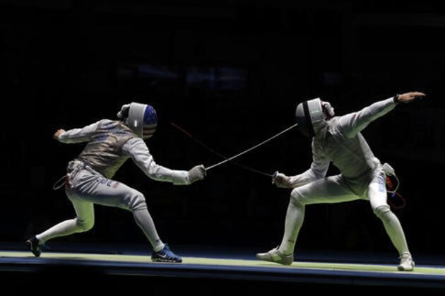 CHAMLEY-WATSON Miles Chamley Watson of the United States, left, and Safin Timur of Russia compete in a men's team foil fencing semifinal at the 2016 Summer Olympics in Rio de Janeiro, Brazil, Friday, Aug. 12, 2016. (AP Photo/Andrew Medichini)