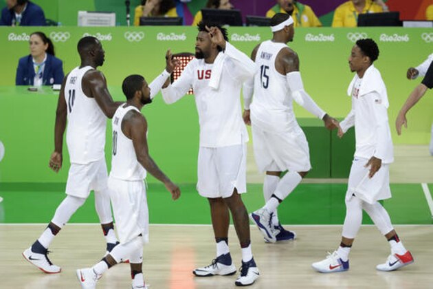 United States' DeAndre Jordan, center, celebrates with teammate during a basketball game against Serbia at the 2016 Summer Olympics in Rio de Janeiro, Brazil, Friday, Aug. 12, 2016. (AP Photo/Charlie Neibergall)