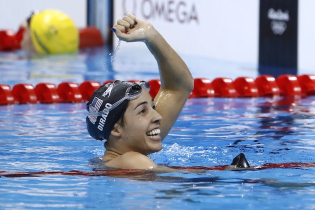CORRECTION - USA's Madeline Dirado celebrates after she won the Women's 200m Backstroke Final during the swimming event at the Rio 2016 Olympic Games at the Olympic Aquatics Stadium in Rio de Janeiro on August 12, 2016.   / AFP / Odd Andersen / The erroneous mention[s] appearing in the metadata of this photo by Odd Andersen has been modified in AFP systems in the following manner: 200M BACKSTROKE instead of 50m FREESTYLE. Please immediately remove the erroneous mention[s] from all your online services and delete it  from your servers. If you have been authorized by AFP to distribute it  to third parties, please ensure that the same actions are carried out by them. Failure to promptly comply with these instructions will entail liability on your part for any continued or post notification usage. Therefore we thank you very much for all your attention and prompt action. We are sorry for the inconvenience this notification may cause and remain at your disposal for any further information you may require.        (