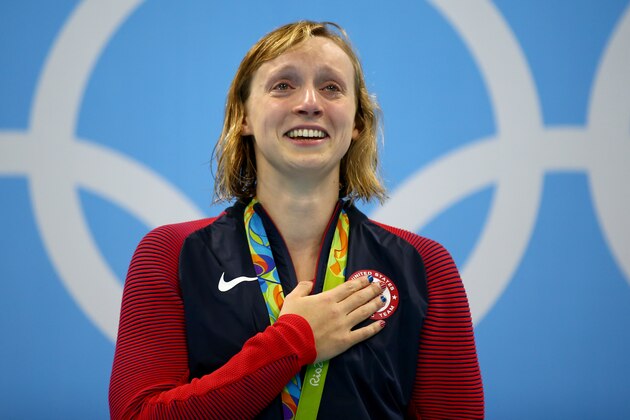 RIO DE JANEIRO, BRAZIL - AUGUST 12:  Katie Ledecky of United States celebrates on the podium after winning gold in the Women's 800m Freestyle Final on Day 7 of the Rio 2016 Olympic Games at the Olympic Aquatics Stadium on August 12, 2016 in Rio de Janeiro, Brazil.  (Photo by Clive Rose/Getty Images)