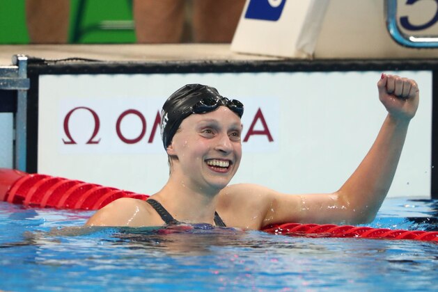 Aug 12, 2016; Rio de Janeiro, Brazil;  Katie Ledecky (USA) celebrates after winning the women's 800m freestyle final at Olympic Aquatics Stadium. Mandatory Credit: Rob Schumacher-USA TODAY Sports
