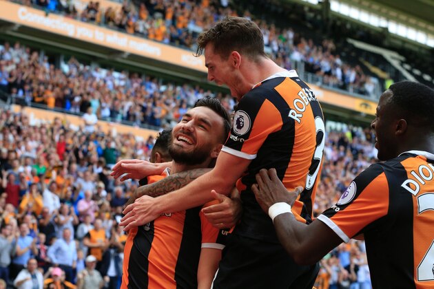 Hull City's Scottish midfielder Robert Snodgrass (L) celebrates with Hull City's Norwegian striker Adama Diomande (R) and Hull City's Scottish defender Andrew Robertson (C) after scoring their second goal during the English Premier League football match between Hull City and Leicester City at the KCOM Stadium in Kingston upon Hull, north east England on August 13, 2016. / AFP / Lindsey PARNABY / RESTRICTED TO EDITORIAL USE. No use with unauthorized audio, video, data, fixture lists, club/league logos or 'live' services. Online in-match use limited to 75 images, no video emulation. No use in betting, games or single club/league/player publications. / (Photo credit should read LINDSEY PARNABY/AFP/Getty Images) Hull City's Scottish midfielder Robert Snodgrass (L) celebrates with Hull City's Norwegian striker Adama Diomande (R) and Hull City's Scottish defender Andrew Robertson (C) after scoring their second goal during the English Premier League football match between Hull City and Leicester City at the KCOM Stadium in Kingston upon Hull, north east England on August 13, 2016. / AFP / Lindsey PARNABY / RESTRICTED TO EDITORIAL USE. No use with unauthorized audio, video, data, fixture lists, club/league logos or 'live' services. Online in-match use limited to 75 images, no video emulation. No use in betting, games or single club/league/player publications. / (Photo credit should read LINDSEY PARNABY/AFP/Getty Images)
