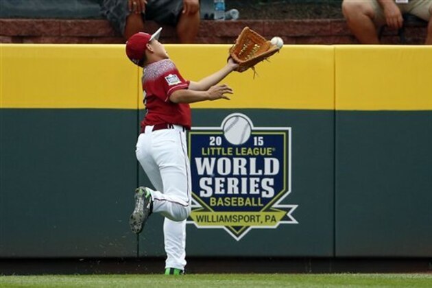 A fly ball to right field by Mexico's Andres Villa gets past Taiwan right fielder Tsung Lin Wu for a triple during the third inning of an International elimination baseball game at the Little League World Series tournament in South Williamsport, Pa., Tuesday, Aug. 25, 2015. Mexico won 11-1. (AP Photo/Gene J. Puskar) A fly ball to right field by Mexico's Andres Villa gets past Taiwan right fielder Tsung Lin Wu for a triple during the third inning of an International elimination baseball game at the Little League World Series tournament in South Williamsport, Pa., Tuesday, Aug. 25, 2015. Mexico won 11-1. (AP Photo/Gene J. Puskar)