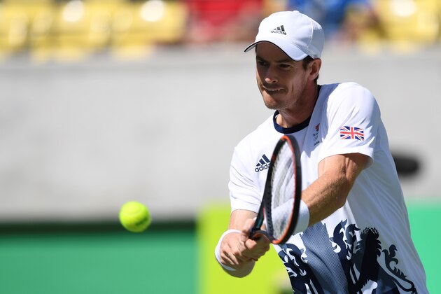 Britain's Andy Murray returns the ball to Japan's Kei Nishikori during their men's singles semi-final tennis match at the Olympic Tennis Centre of the Rio 2016 Olympic Games in Rio de Janeiro on August 13, 2016. / AFP / Martin BERNETTI        (Photo credit should read MARTIN BERNETTI/AFP/Getty Images)