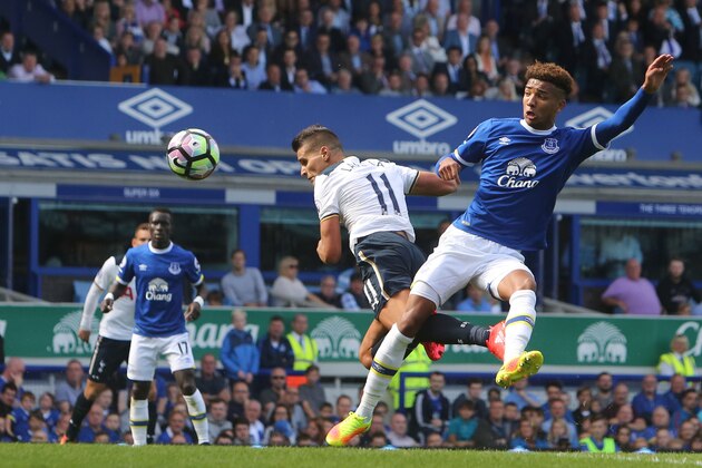Tottenham Hotspur's Argentinian midfielder Erik Lamela (C) scores an equalising goal for 1-1 during the English Premier League football match between Everton and Tottenham Hotspur at Goodison Park in Liverpool, north west England on August 13, 2016. / AFP / GEOFF CADDICK / RESTRICTED TO EDITORIAL USE. No use with unauthorized audio, video, data, fixture lists, club/league logos or 'live' services. Online in-match use limited to 75 images, no video emulation. No use in betting, games or single club/league/player publications.  /         (Photo credit should read GEOFF CADDICK/AFP/Getty Images)