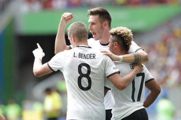 Germany's Serge Gnabry, right, is congratulated after scoring his side's first goal during a quarter-final match of the men's Olympic football tournament between Germany and Portugal at the National Stadium, in Brasilia, Brazil, Saturday, Aug. 13, 2016. (AP Photo/Eraldo Peres)