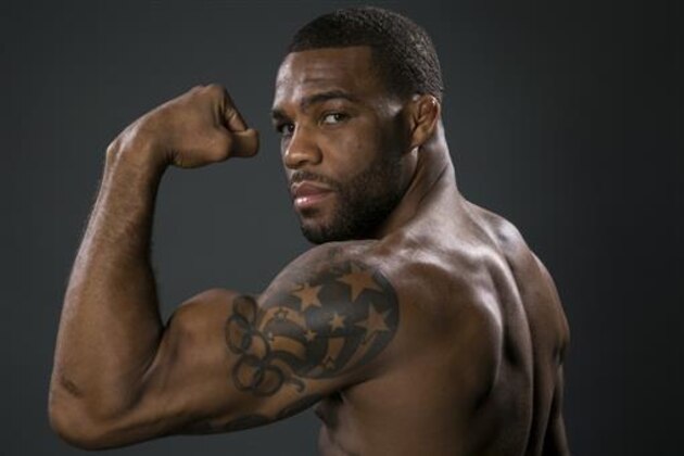 FILE - In this March 9, 2016, file photo, U.S. Olympic gold medalist wrestler Jordan Burroughs poses for photos at the 2016 Team USA Media Summit in Beverly Hills, Calif. Burroughs used his gold-medal moment at the 2012 Olympics in London to emerge as one of wrestling’s biggest stars. A year later, the world’s oldest sport turned to Burroughs to help save its future. (AP Photo/Damian Dovarganes, File)
