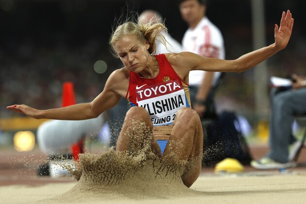 Russia's Darya Klishina competes in the final of the women's long jump athletics event at the 2015 IAAF World Championships at the 'Bird's Nest' National Stadium in Beijing on August 28, 2015.  AFP PHOTO / ADRIAN DENNIS        (Photo credit should read ADRIAN DENNIS/AFP/Getty Images)