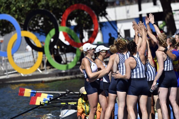 Rowers of the USA's team celebrate after winning the Women's Eight final rowing competition at the Lagoa stadium during the Rio 2016 Olympic Games in Rio de Janeiro on August 13, 2016. / AFP / Jeff PACHOUD        (Photo credit should read JEFF PACHOUD/AFP/Getty Images)