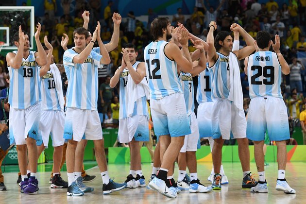 Argentina's players acknowledge the public after defeating Brazil during a Men's round Group B basketball match between Argentina and Brazil at the Carioca Arena 1 in Rio de Janeiro on August 13, 2016 during the Rio 2016 Olympic Games. / AFP / Mark RALSTON        (Photo credit should read MARK RALSTON/AFP/Getty Images)