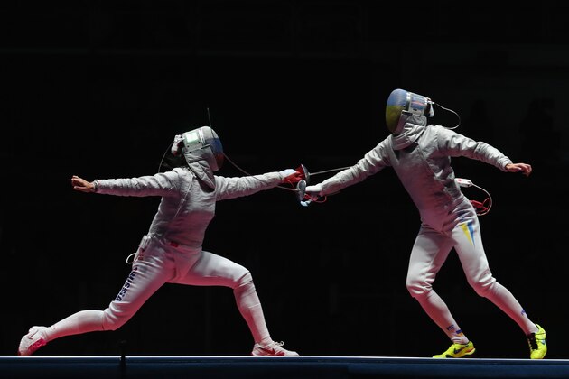 RIO DE JANEIRO, BRAZIL - AUGUST 13:  Yana Egorian of Russia competes against Olga Kharlan of Ukraine during the Women's Sabre Team gold medal match between Russia and Ukraine on Day 8 of the Rio 2016 Olympic Games at Carioca Arena 3 on August 13, 2016 in Rio de Janeiro, Brazil.  (Photo by Tom Pennington/Getty Images)