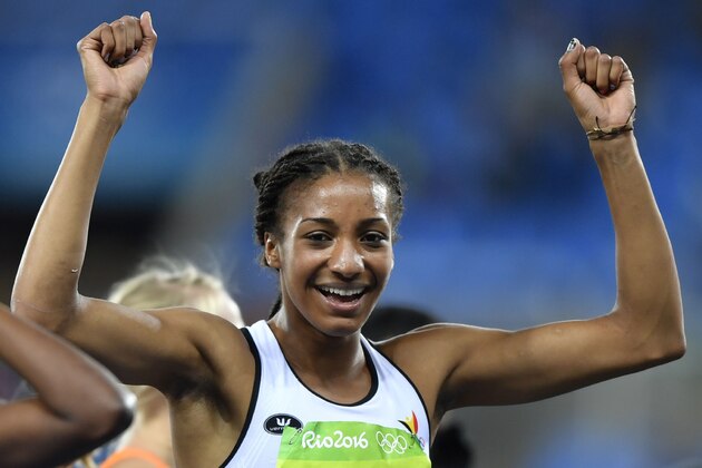 Belgium's Nafissatou Thiam celebrates winning  Women's Heptathlon during the athletics event at the Rio 2016 Olympic Games at the Olympic Stadium in Rio de Janeiro on August 13, 2016.   / AFP / Fabrice COFFRINI        (Photo credit should read FABRICE COFFRINI/AFP/Getty Images)