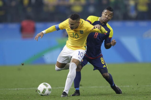 Brazil's Neymar, left, is tackled by Colombia's Dorlan Pabon during a quarter-final match of the men's Olympic football tournament between Brazil and Colombia at the Arena Corinthians stadium, in Sao Paulo, Brazil, Saturday, Aug. 13, 2016. (AP Photo/Nelson Antoine)