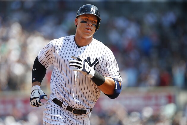 NEW YORK, NY - AUGUST 13: Aaron Judge #99 of the New York Yankees rounds the bases after he hit a home run in his first MLB at bat during the second inning of a game against the Tampa Bay Rays at Yankee Stadium on August 13, 2016 in the Bronx borough of New York City. (Photo by Rich Schultz/Getty Images)