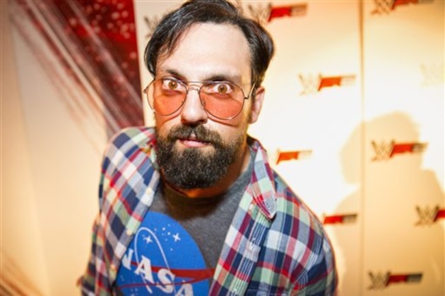 IMAGE DISTRIBUTED FOR 2K - WWE Superstar Damien Sandow, dressed as a stereotypical gamer, at the WWE 2K15 Press Event at Cicada Restaurant, on Saturday, August 16, 2014 in Los Angeles. (Photo by Colin Young-Wolff/Invision for 2K/AP Images)