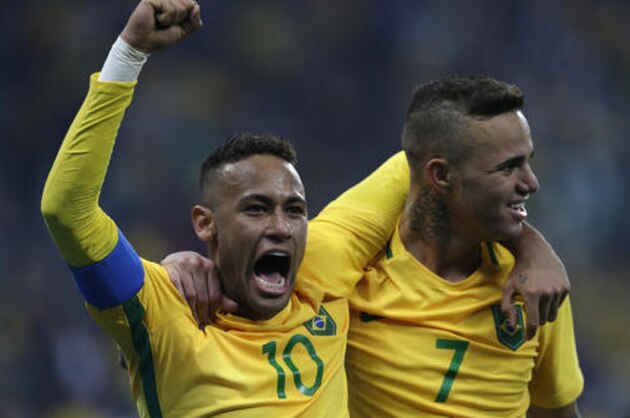 Brazil's Luan, right, celebrates with teammate Neymar after scoring his team's second goal during a quarter-final match of the men's Olympic football tournament between Brazil and Colombia in Sao Paulo, Brazil, Saturday Aug. 13, 2016. Brazil won 2-0 going through to the semi-finals.(AP Photo/Leo Correa)