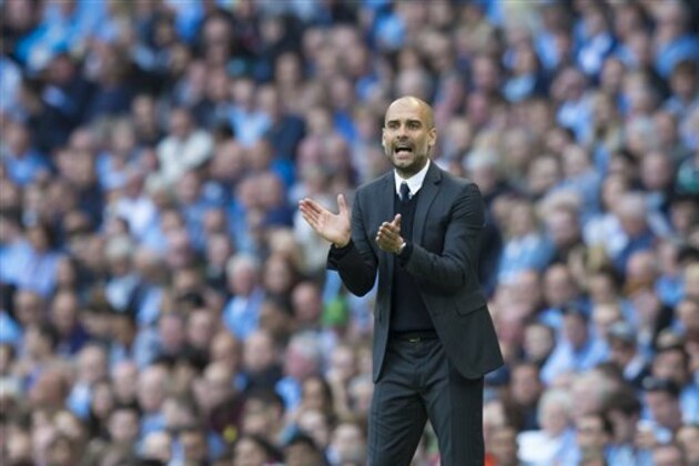 Manchester City's new manager Pep Guardiola applauds during the English Premier League soccer match between Manchester City and Sunderland at the Etihad Stadium in Manchester, England, Saturday Aug. 13, 2016. (AP Photo/Jon Super)