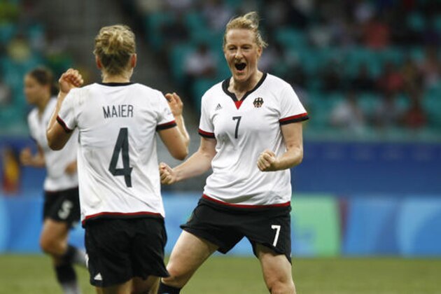 Germany's Melanie Behringer, right, celebrates her goal with teammate Germany's Leonie Maier during a quarter-final match of the women's Olympic football tournament between Germany and China at the Fonte Nova Arena in Salvador, Brazil, Friday, Aug. 12, 2016. (AP Photo/Arisson Marinho)