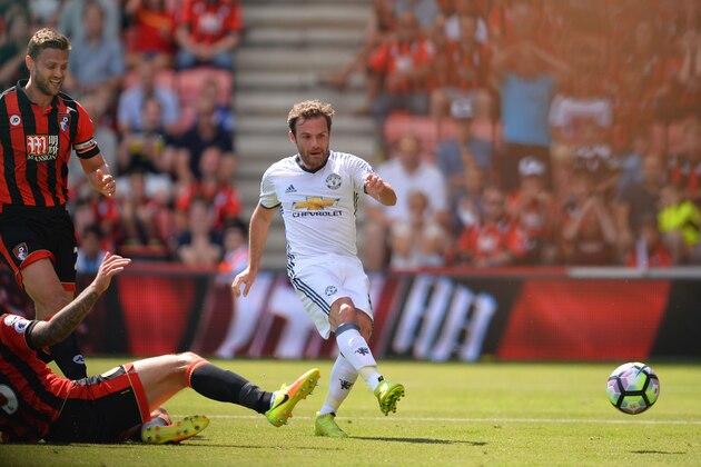 Manchester United's Spanish midfielder Juan Mata (R) scores the opening goal during the English Premier League football match between Bournemouth and Manchester United at the Vitality Stadium in Bournemouth, southern England on August 14, 2016. / AFP / GLYN KIRK / RESTRICTED TO EDITORIAL USE. No use with unauthorized audio, video, data, fixture lists, club/league logos or 'live' services. Online in-match use limited to 75 images, no video emulation. No use in betting, games or single club/league/player publications.  /         (Photo credit should read GLYN KIRK/AFP/Getty Images)
