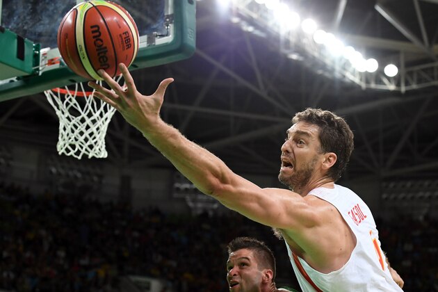 TOPSHOT - Spain's centre Pau Gasol reaches out to the ball during a Men's round Group B basketball match between Spain and Lithuania at the Carioca Arena 1 in Rio de Janeiro on August 13, 2016 during the Rio 2016 Olympic Games. / AFP / Mark RALSTON        (Photo credit should read MARK RALSTON/AFP/Getty Images)