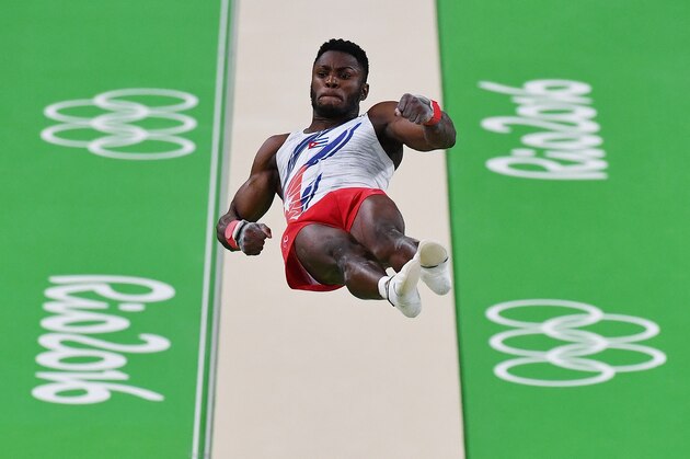 Cuba's Manrique Bicet competes in the vault event of the men's individual all-around final of the Artistic Gymnastics at the Olympic Arena during the Rio 2016 Olympic Games in Rio de Janeiro on August 10, 2016. / AFP / Ben STANSALL        (Photo credit should read BEN STANSALL/AFP/Getty Images)