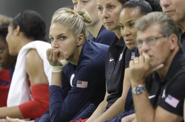 United States guard Elena Delle Donne, left center, sits on the bench during the second half of a women's basketball game against China at the Youth Center at the 2016 Summer Olympics in Rio de Janeiro, Brazil, Sunday, Aug. 14, 2016. Delle Donne did not play due to a pre game eye poke by a teammate.(AP Photo/Carlos Osorio)