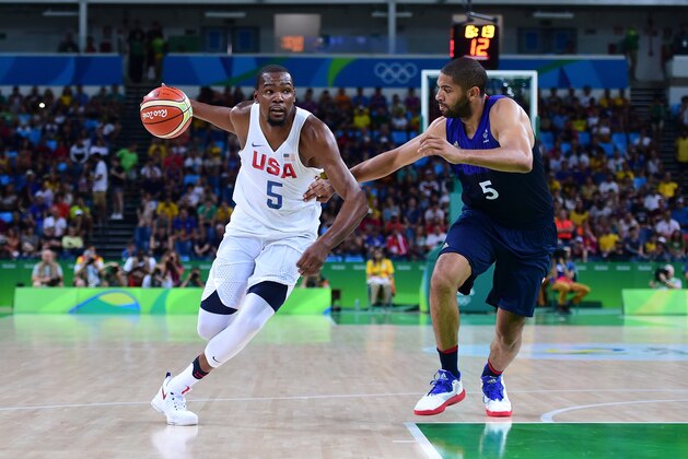 RIO DE JANEIRO, BRAZIL - AUGUST 14:  Kevin Durant #5 of United States moves the ball against Nicolas Batum #5 of France during a Men's Preliminary Round Group A game between the United States and France on Day 9 of the Rio 2016 Olympic Games at Carioca Arena 1 on August 14, 2016 in Rio de Janeiro, Brazil.  (Photo by Harry How/Getty Images)