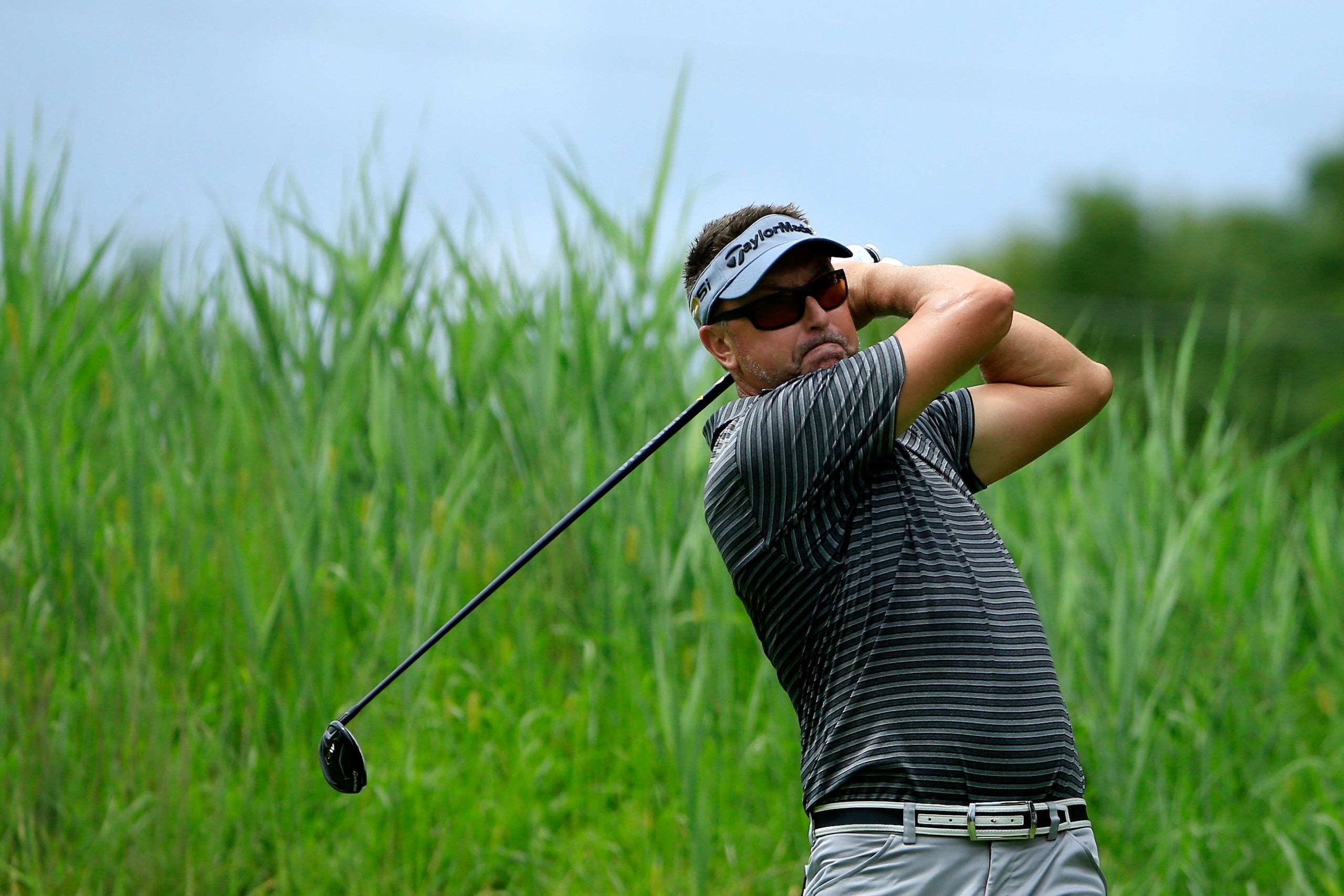 SILVIS, IL - AUGUST 12:  Robert Allenby of Australia plays his shot from the 11th tee during the second round of the John Deere Classic at TPC Deere Run on August 12, 2016 in Silvis, Illinois.  (Photo by Michael Cohen/Getty Images)