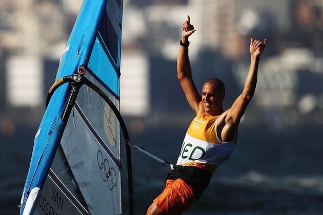 RIO DE JANEIRO, BRAZIL - AUGUST 14:  Dorian van Rijsselberghe of the Netherlands celebrates winning the overall Men's RS:X class on Day 9 of the Rio 2016 Olympic Games at the Marina da Gloria on August 14, 2016 in Rio de Janeiro, Brazil.  (Photo by Mark Kolbe/Getty Images)