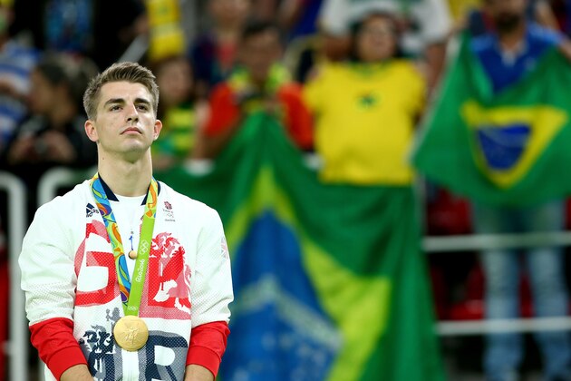 RIO DE JANEIRO, BRAZIL - AUGUST 14:  Gold medalist Max Whitlock of Great Britain stands on the podium at the medal ceremony for Men's Floor Exercise on Day 9 of the Rio 2016 Olympic Games at the Rio Olympic Arena on August 14, 2016 in Rio de Janeiro, Brazil.  (Photo by Alex Livesey/Getty Images)