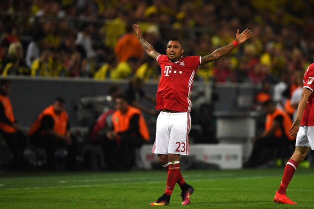 Bayern Munich's Chilean midfielder Arturo Vidal celebrates during the German Super Cup football match final Borussia Dortmund vs FC Bayern Munich in Dortmund on August 14, 2016. / AFP / PATRIK STOLLARZ / RESTRICTIONS: DURING MATCH TIME: DFL RULES TO LIMIT THE ONLINE USAGE TO 15 PICTURES PER MATCH AND FORBID IMAGE SEQUENCES TO SIMULATE VIDEO. == RESTRICTED TO EDITORIAL USE == FOR FURTHER QUERIES PLEASE CONTACT DFL DIRECTLY AT + 49 69 650050
        (Photo credit should read PATRIK STOLLARZ/AFP/Getty Images)