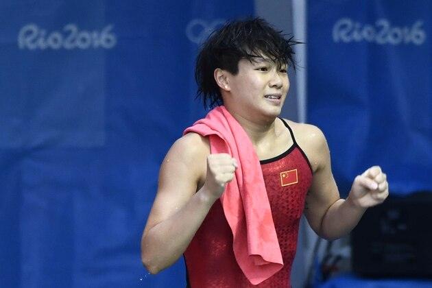 China's Shi Tingmao celebrates after winning the Women's 3m Springboard Final during the diving event at the Rio 2016 Olympic Games at the Maria Lenk Aquatics Stadium in Rio de Janeiro on August 14, 2016.   / AFP / CHRISTOPHE SIMON        (Photo credit should read CHRISTOPHE SIMON/AFP/Getty Images)