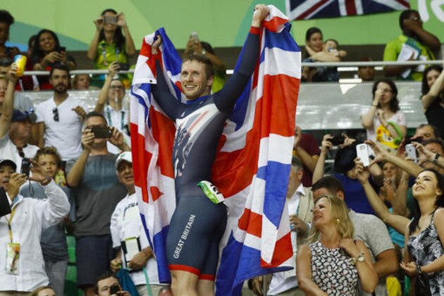 Jason Kenny of Britain celebrates after winning gold in the men's cycling sprint final at the Rio Olympic Velodrome during the 2016 Summer Olympics in Rio de Janeiro, Brazil, Sunday, Aug. 14, 2016. (AP Photo/Patrick Semansky)