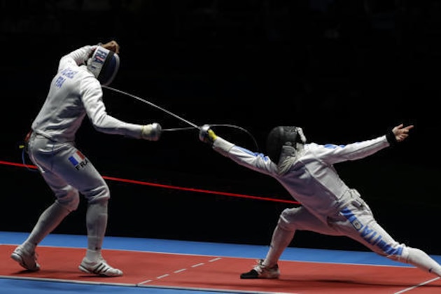 Yannick Borel of France, left, and Paolo Pizzo of Italy compete in a men's team epee fencing final at the 2016 Summer Olympics in Rio de Janeiro, Brazil, Sunday, Aug. 14, 2016. (AP Photo/Andrew Medichini)