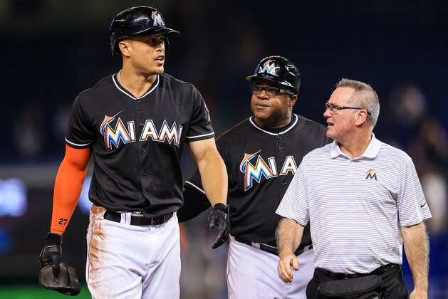 MIAMI, FL - AUGUST 13: Giancarlo Stanton #27 of the Miami Marlins walks off the field injured after the last play of the game against the Chicago White Sox at Marlins Park on August 13, 2016 in Miami, Florida. (Photo by Rob Foldy/Getty Images)