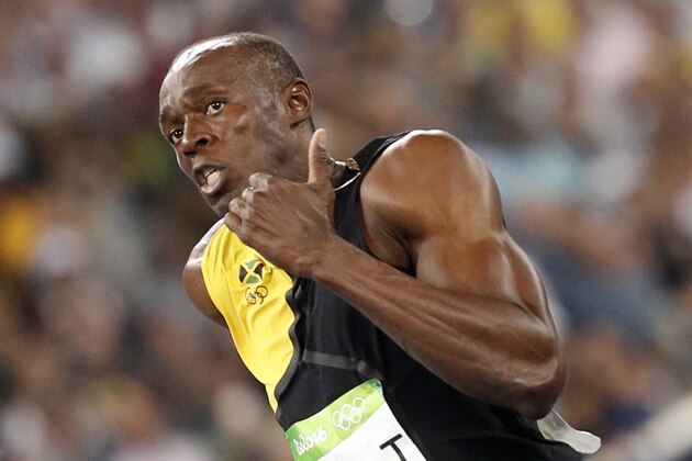 Jamaica's Usain Bolt competes to win in the Men's 100m Final during the athletics event at the Rio 2016 Olympic Games at the Olympic Stadium in Rio de Janeiro on August 14, 2016.   / AFP / Adrian DENNIS        (Photo credit should read ADRIAN DENNIS/AFP/Getty Images)