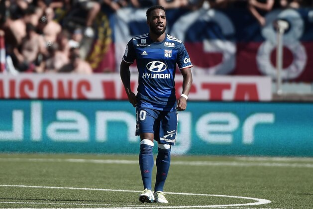Lyon's French forward Alexandre Lacazette celebrates after scoring a goal during the French L1 football match between Nancy (ASNL) and Lyon (OL), on August 14, 2016 at the Marcel Picot Stadium, in Tomblaine, eastern France.  / AFP / FREDERICK FLORIN        (Photo credit should read FREDERICK FLORIN/AFP/Getty Images)