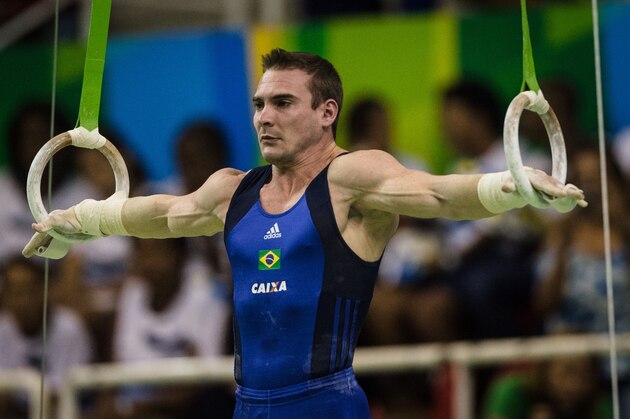 Brazil's Arthur Zanetti competes in the Still rings final during the artistic gymnastics test event for Rio 2016's Olympic games at Rio Olympic Arena in the Olympic Park in Rio de Janeiro, Brazil, on April 18, 2016. / AFP / YASUYOSHI CHIBA        (Photo credit should read YASUYOSHI CHIBA/AFP/Getty Images)