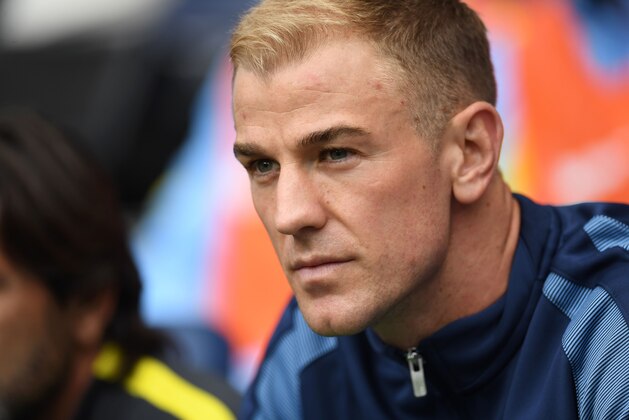 Manchester City's English goalkeeper Joe Hart sits on the substitutes bench for the English Premier League football match between Manchester City and Sunderland at the Etihad Stadium in Manchester, north west England, on August 13, 2016.
Manchester City manager Pep Guardiola dropped goalkeeper Joe Hart in favour of Willy Caballero for his opening Premier League game against Sunderland on August 13. / AFP / PAUL ELLIS / RESTRICTED TO EDITORIAL USE. No use with unauthorized audio, video, data, fixture lists, club/league logos or 'live' services. Online in-match use limited to 75 images, no video emulation. No use in betting, games or single club/league/player publications.  /         (Photo credit should read PAUL ELLIS/AFP/Getty Images)