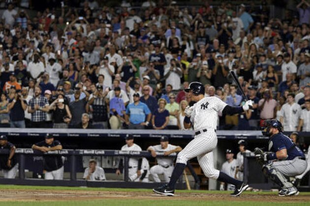 New York Yankees designated hitter Alex Rodriguez follows through on an RBI double during the first inning of a baseball game against the Tampa Bay Rays on Friday, Aug. 12, 2016, in New York. (AP Photo/Adam Hunger)